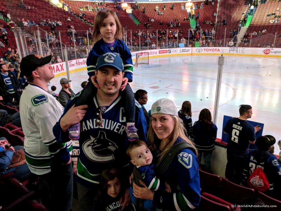Smiling family at a Canucks hockey game 