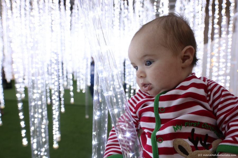 Baby in Christmas lights 