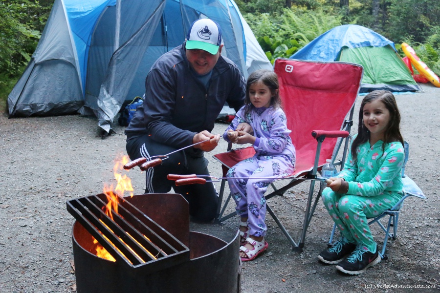 Family roasting hot dogs at Birkenhead Lake in Pemberton, BC
