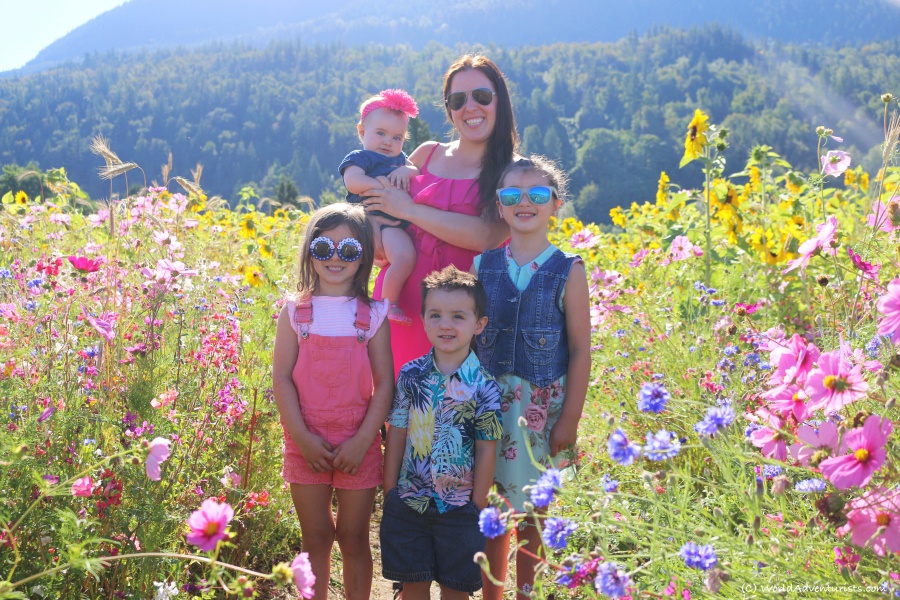 A mom and kids in a wildflower field 
