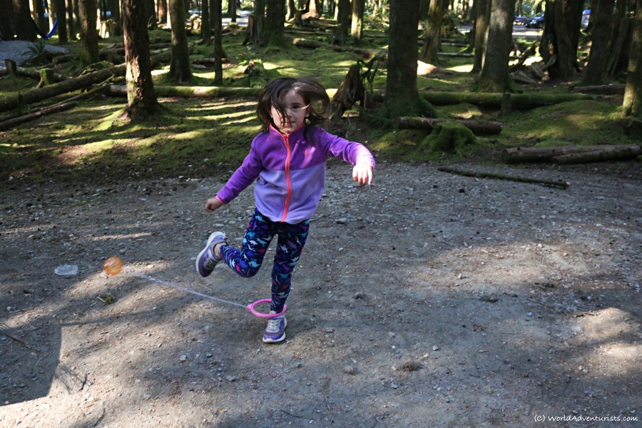 Kid playing with a Skip-it at Golden Ears Provincial Park